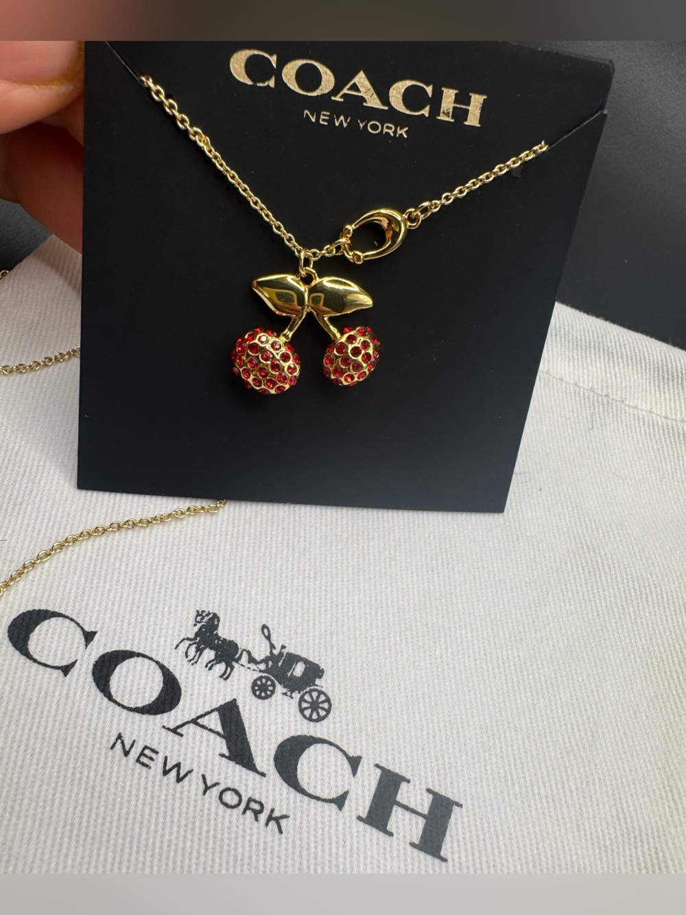 Coach Gold Cherry Pendant Necklace with Red Crystal Accents